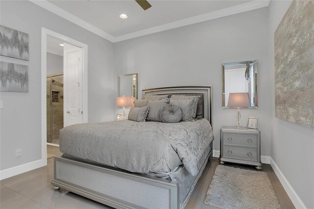 bedroom with ceiling fan, crown molding, and ensuite bath