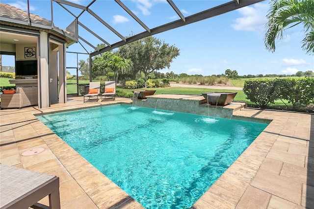 view of pool with a patio area and pool water feature