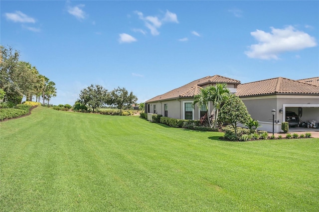 4507 Terrazza Ct, Bradenton, FL 34211 - view of green lawn featuring a garage