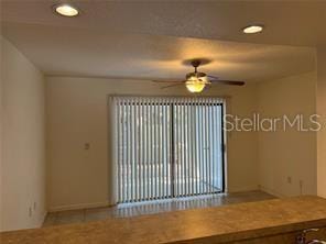 unfurnished room featuring ceiling fan