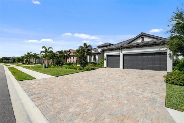 view of front facade featuring a garage and a front yard