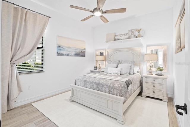 bedroom featuring light wood-type flooring and ceiling fan