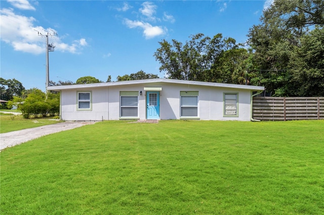 ranch-style home with a front yard