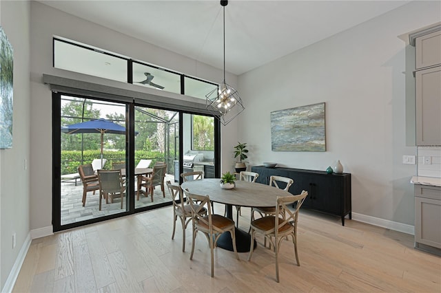 dining space with light hardwood / wood-style flooring