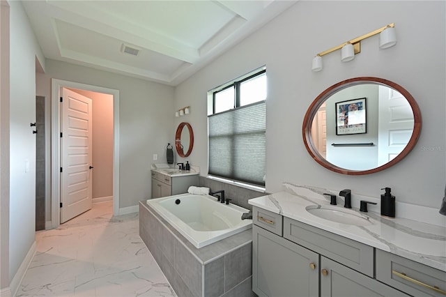 bathroom featuring vanity and a tub