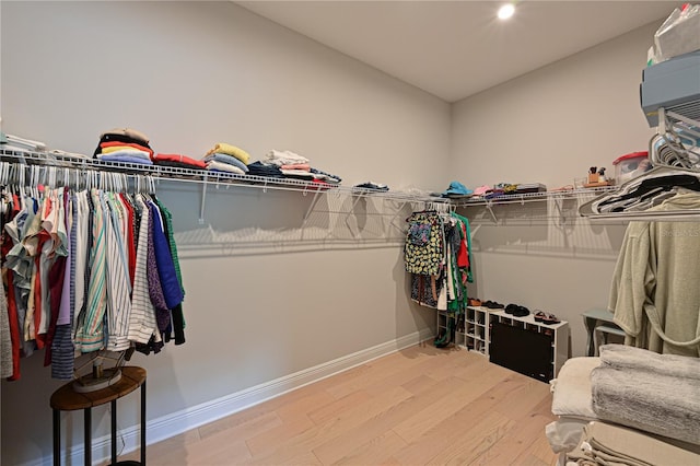 walk in closet featuring hardwood / wood-style floors