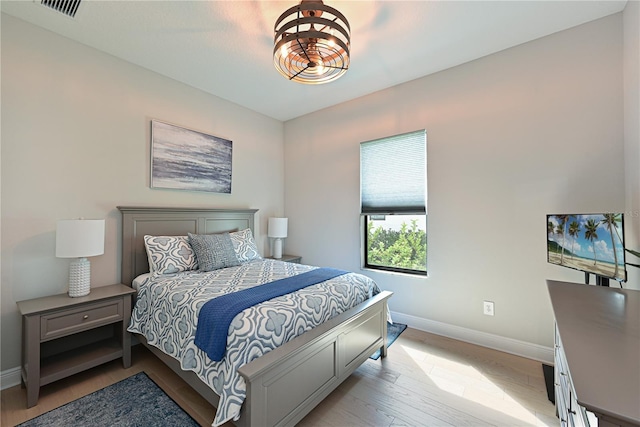 bedroom with light wood-type flooring