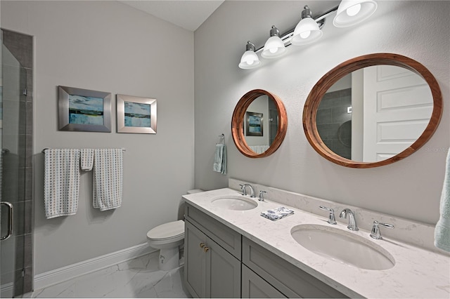 bathroom with vanity, toilet, and an enclosed shower