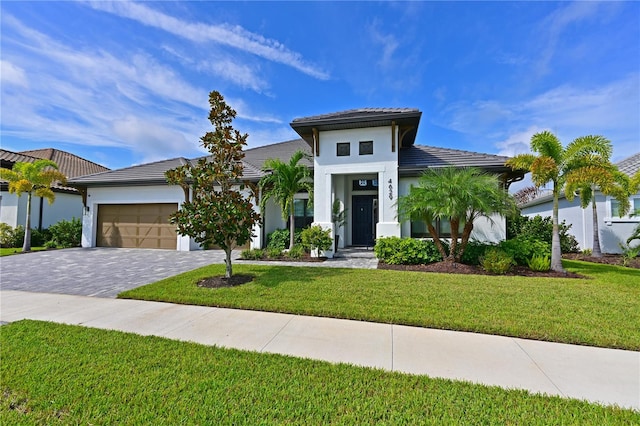 view of front facade with a front lawn and a garage