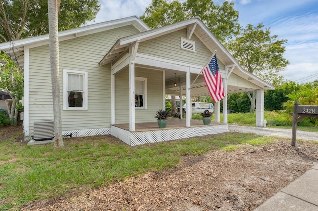 bungalow-style house featuring central AC and covered porch