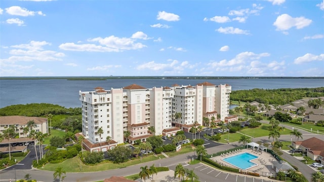 birds eye view of property with a water view