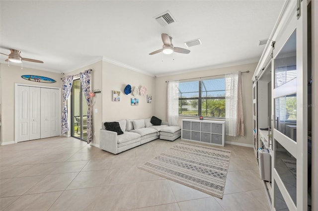 tiled living room with ornamental molding and ceiling fan