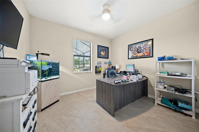 home office featuring light tile patterned flooring and ceiling fan