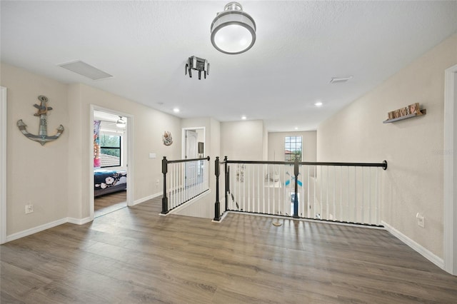 interior space featuring wood-type flooring and plenty of natural light