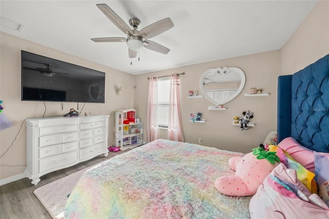 bedroom featuring ceiling fan and dark hardwood / wood-style flooring