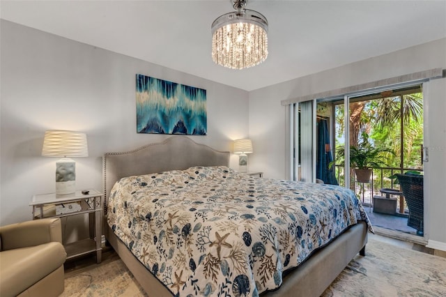 bedroom with a notable chandelier and access to outside