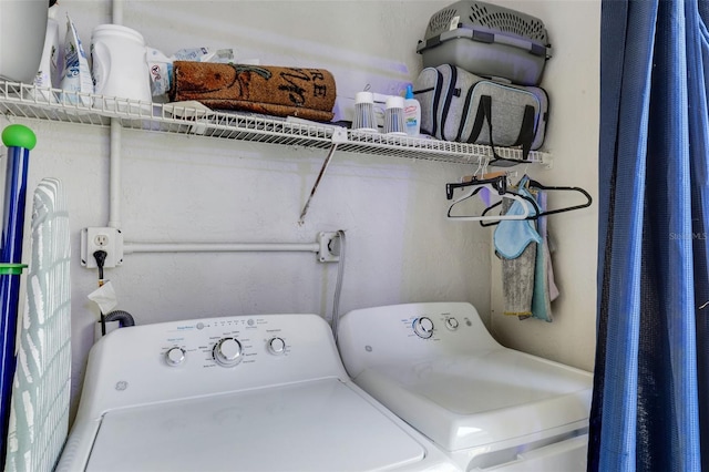 clothes washing area with independent washer and dryer