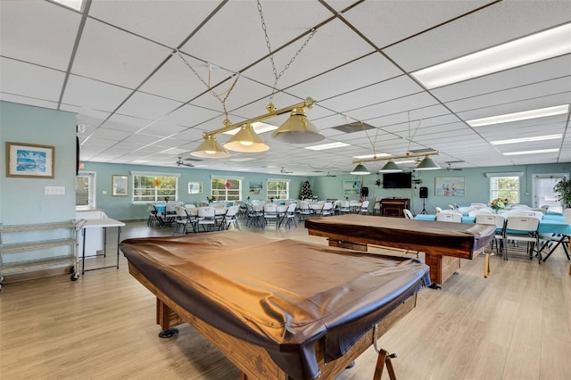 playroom with light wood-type flooring, plenty of natural light, pool table, and a drop ceiling