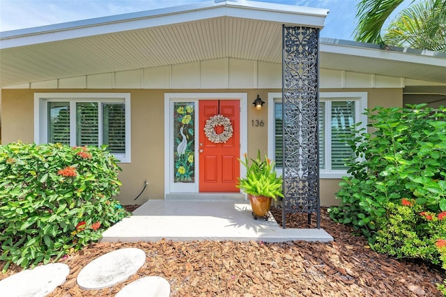 136 Crescent Dr, Anna Maria, FL 34216 - entrance to property with stucco siding