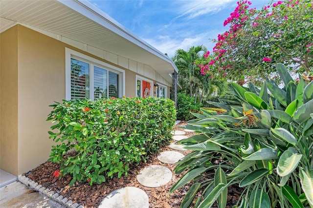 136 Crescent Dr, Anna Maria, FL 34216 - view of side of property with stucco siding