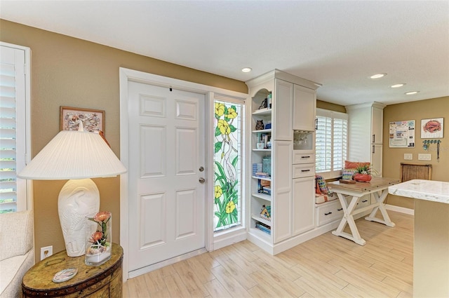 136 Crescent Dr, Anna Maria, FL 34216 - foyer entrance with baseboards, recessed lighting, and light wood-style flooring