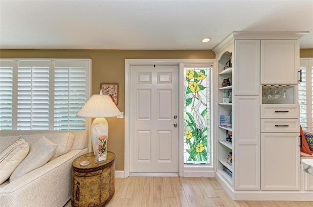 136 Crescent Dr, Anna Maria, FL 34216 - foyer entrance featuring recessed lighting, baseboards, and light wood finished floors