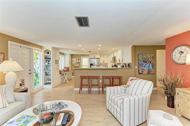 136 Crescent Dr, Anna Maria, FL 34216 - living area with visible vents, recessed lighting, baseboards, and light wood-type flooring
