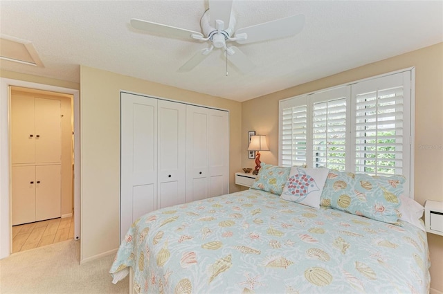 136 Crescent Dr, Anna Maria, FL 34216 - bedroom with ceiling fan, baseboards, carpet, and a closet