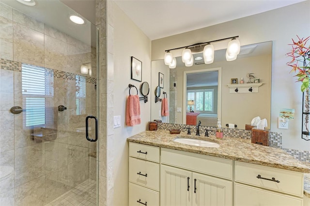 136 Crescent Dr, Anna Maria, FL 34216 - bathroom with vanity, connected bathroom, and a stall shower