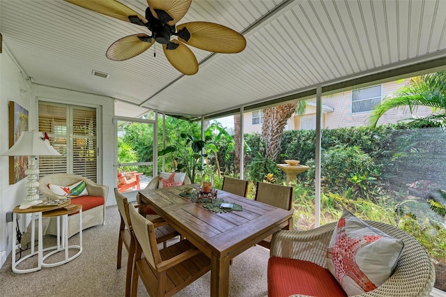 136 Crescent Dr, Anna Maria, FL 34216 - sunroom featuring visible vents, a ceiling fan, and outdoor dining area
