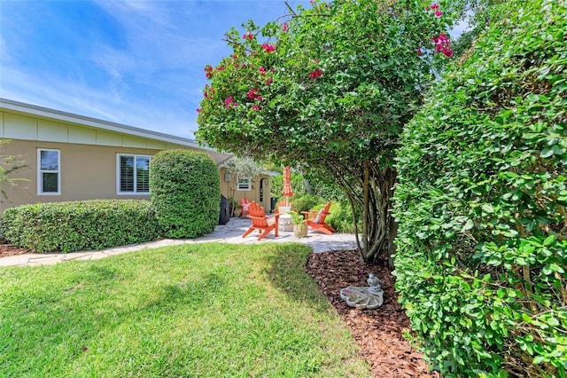 136 Crescent Dr, Anna Maria, FL 34216 - view of yard featuring a patio