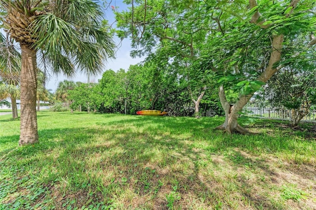 136 Crescent Dr, Anna Maria, FL 34216 - view of yard featuring fence