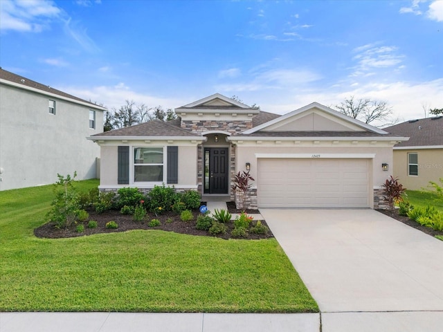 view of front of property with a front yard and a garage