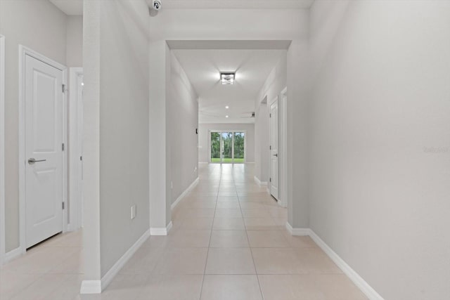 hallway featuring light tile patterned floors