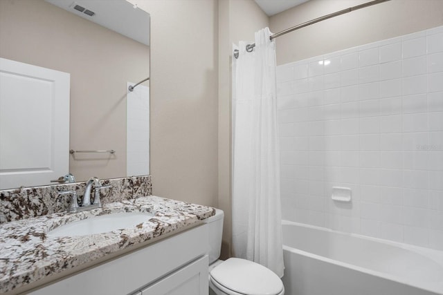 full bathroom featuring vanity, toilet, and shower / tub combo with curtain