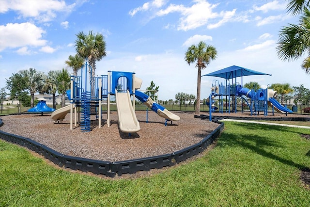 view of playground with a lawn