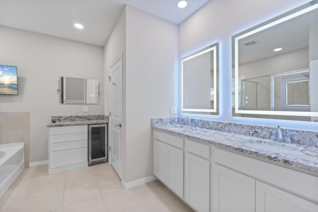 bathroom featuring vanity, beverage cooler, independent shower and bath, and tile patterned floors