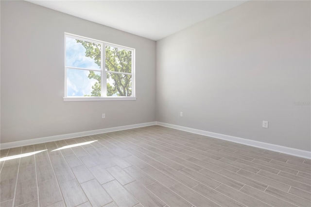 empty room with light hardwood / wood-style floors