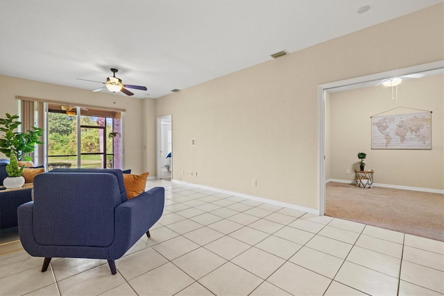 tiled living room featuring ceiling fan