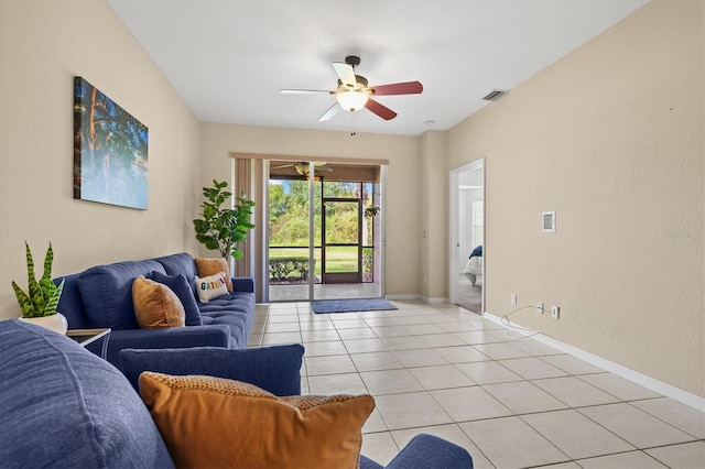 tiled living room featuring ceiling fan