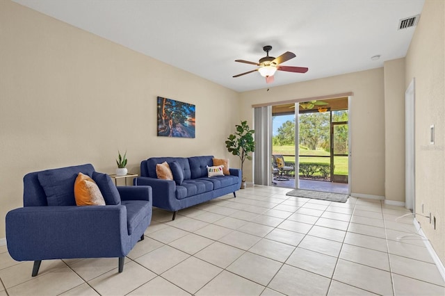 tiled living room featuring ceiling fan