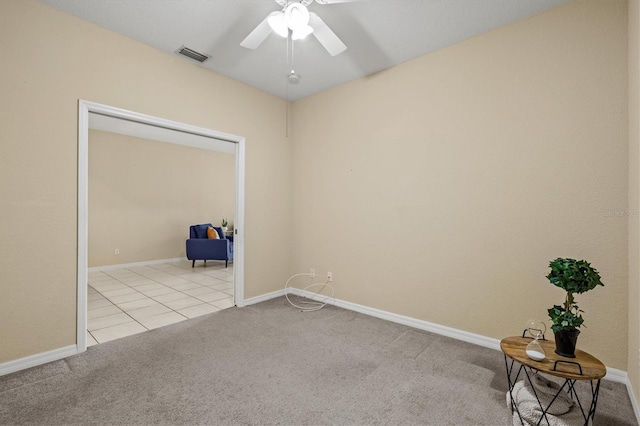 empty room with light carpet and ceiling fan