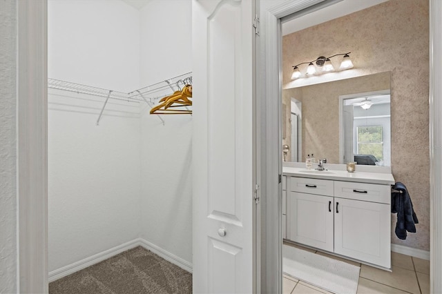 bathroom with vanity, tile patterned floors, and ceiling fan