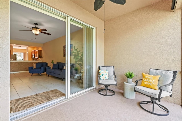 view of patio featuring ceiling fan