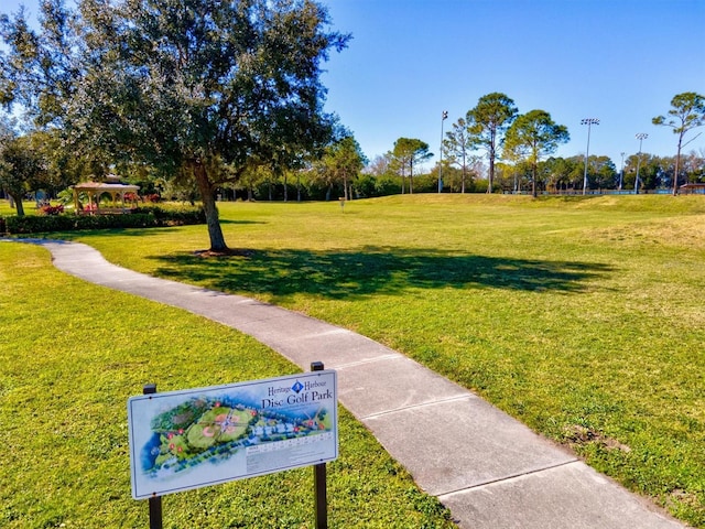 view of property's community featuring a lawn and a gazebo