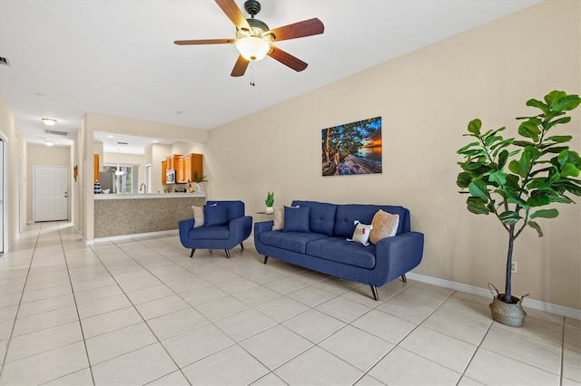 tiled living room featuring ceiling fan