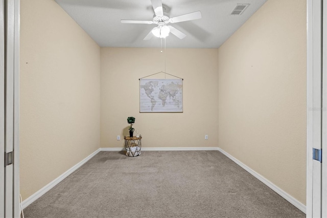 spare room featuring ceiling fan and light colored carpet