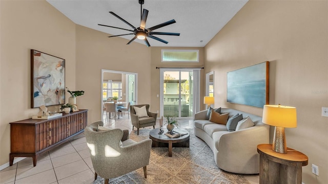 living room with high vaulted ceiling, ceiling fan, and light tile patterned floors