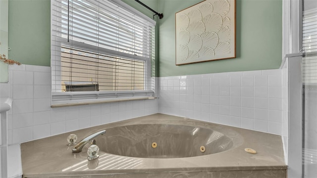 bathroom with tiled bath