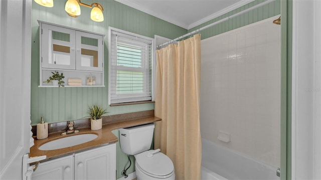 full bathroom featuring ornamental molding, vanity, toilet, and shower / tub combo